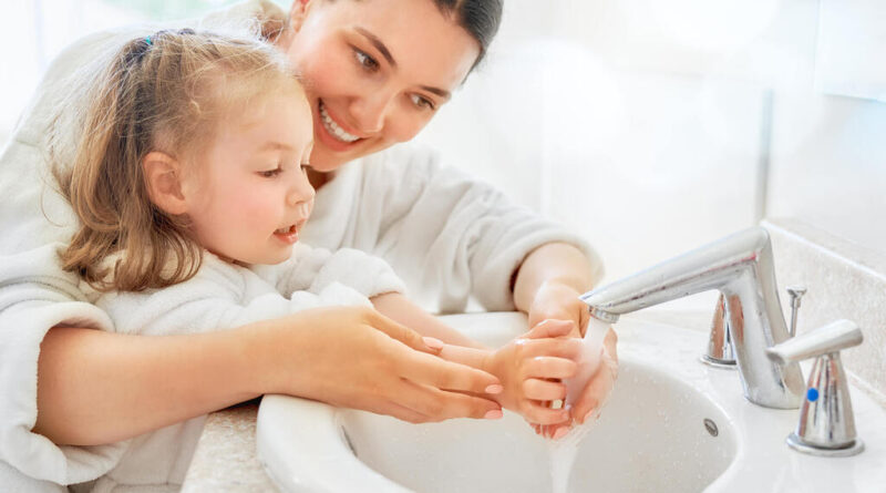Mother & Her Daughter Washing Hand To Define Hygienic
